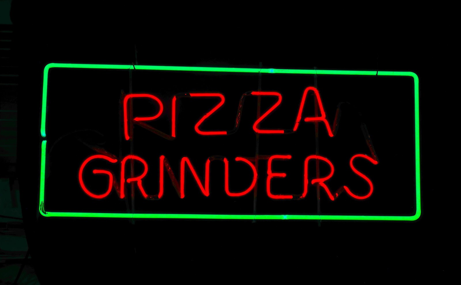 PIZZA GRINDERS neon sign